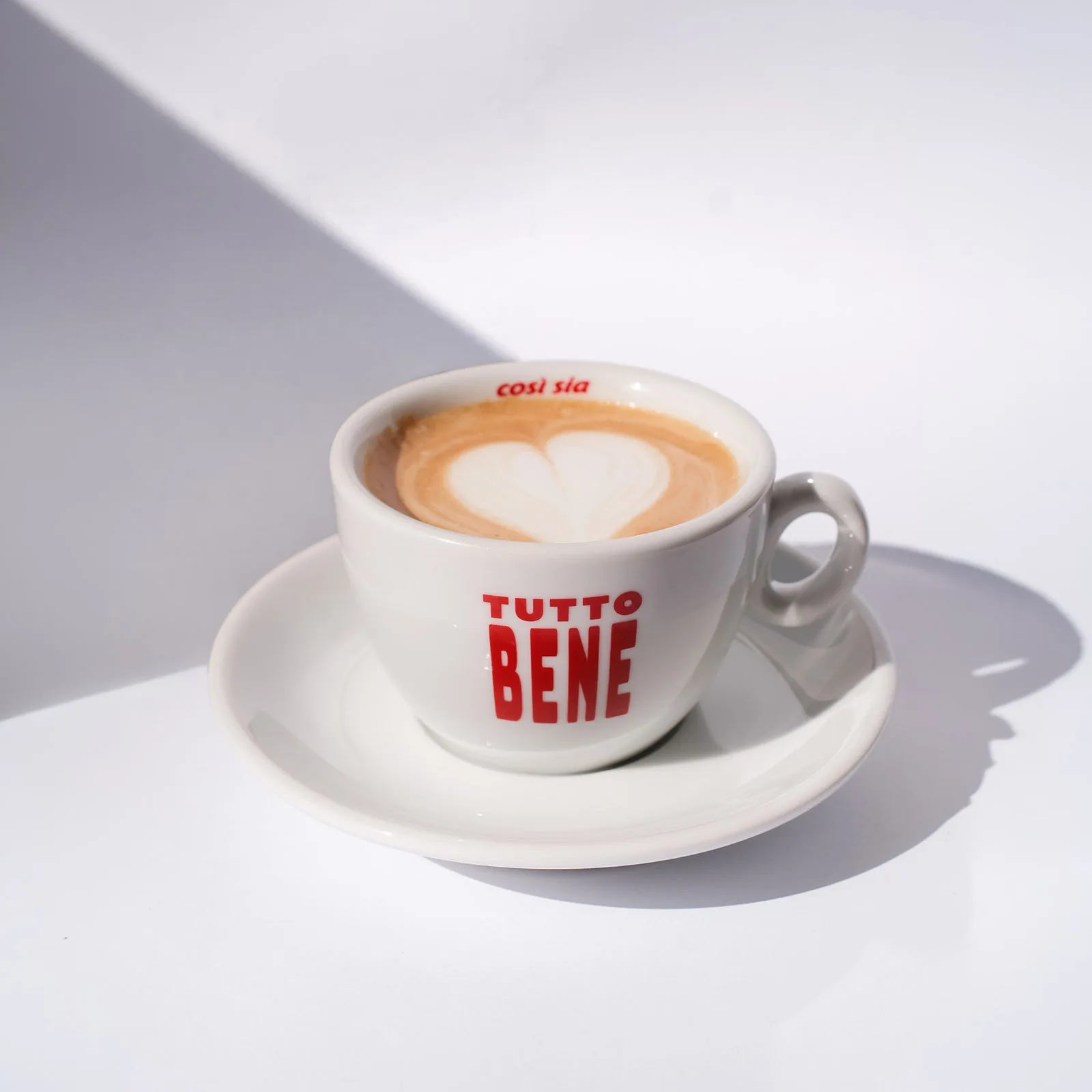 Tutto Bene designer cappuccino cup by artless STUDIO — bold red typography on white porcelain
