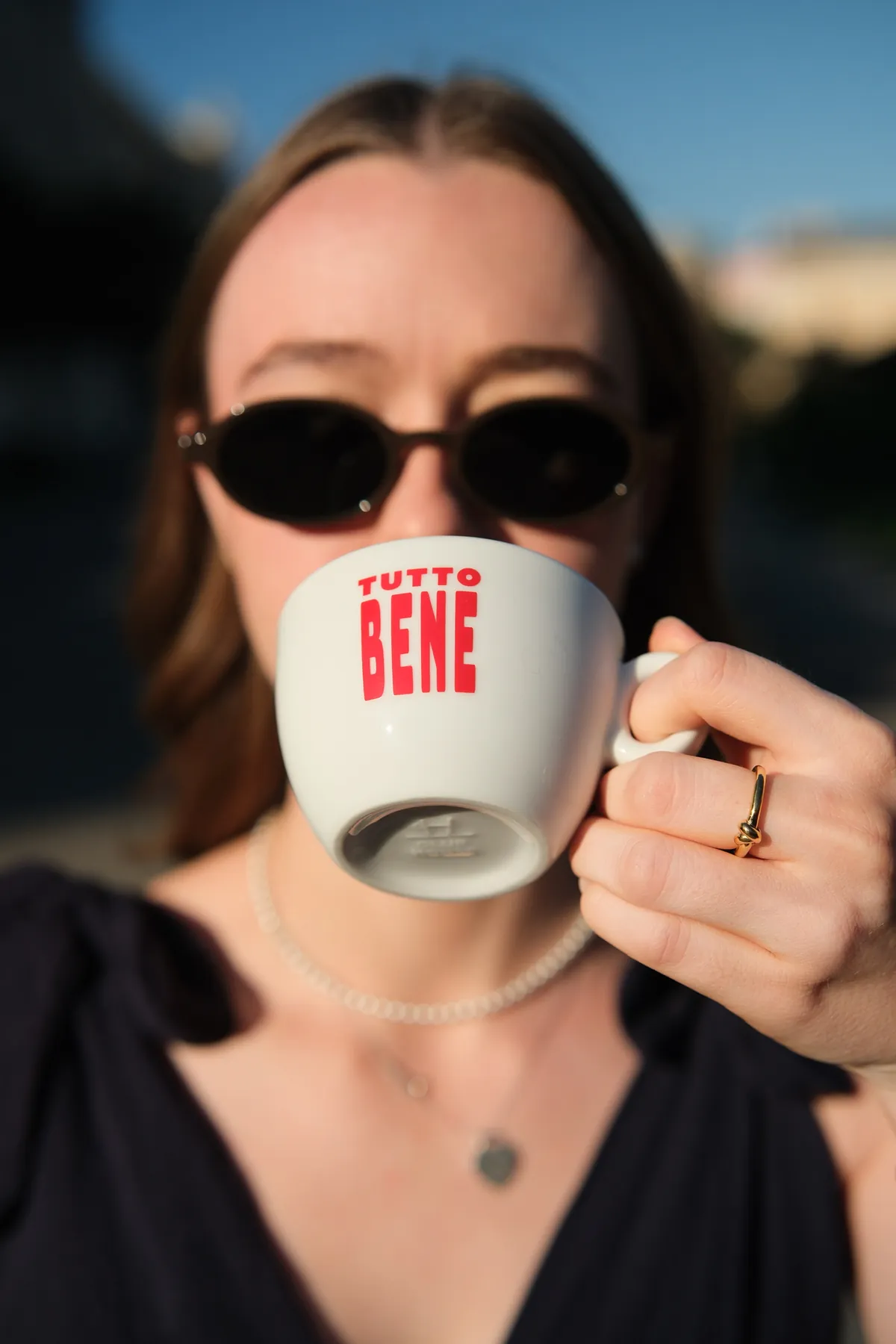 Drinking an espresso from the Tutto Bene cup